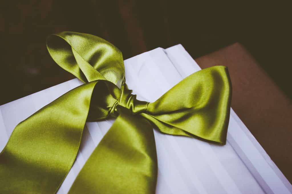 Green ribbon wrapped gift